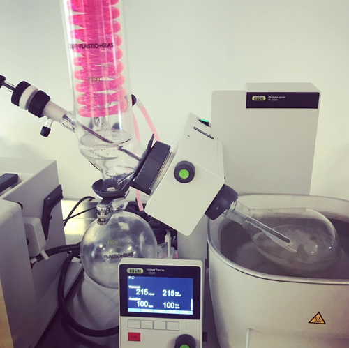 A rotary evaporator distilling botanicals in the lab